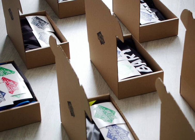 Folded Too High To Die jerseys packed in boxes ready to ship