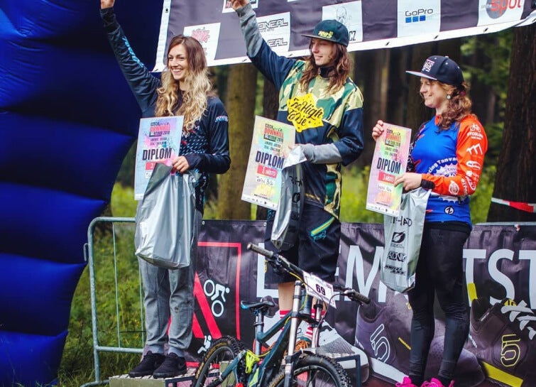 Podium at a downhill race – a Too High To Die rider on the box