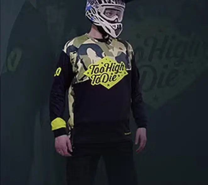 A rider in a camo Too High To Die jersey and full-face helmet