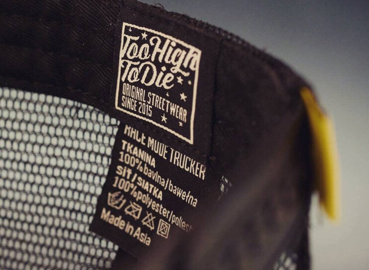 Close-up of a Too High To Die trucker cap with the Original Streetwear since 2015 label